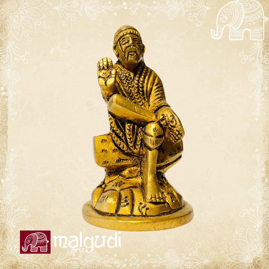 Brass statue of Sai Baba in blessing pose