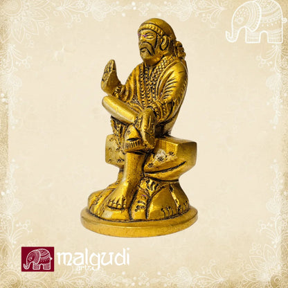Brass statue of Sai Baba in blessing pose