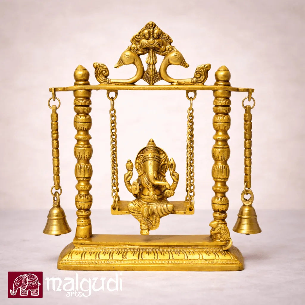 Ornate brass Ganesh on swing, with chain and bells
