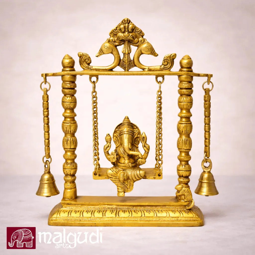 Ornate brass Ganesh on swing, with chain and bells