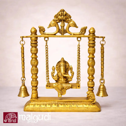 Ornate brass Ganesh on swing, with chain and bells